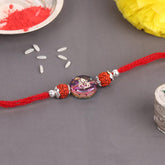 Dual Rudraksha With Color Change Ganesha Stone  Bead Silver Rakhi